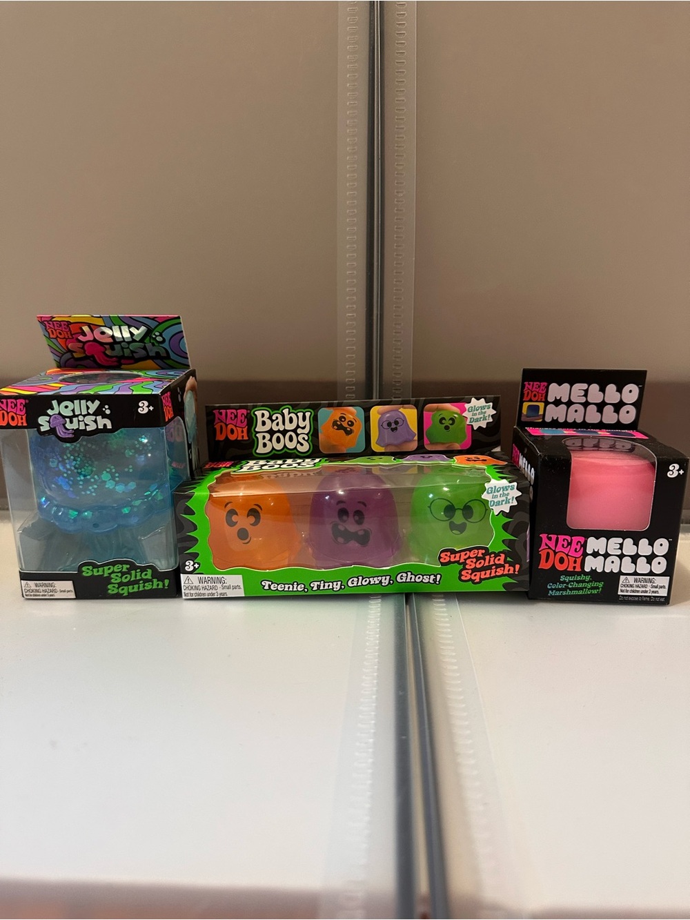 NeeDoh Baby Boos & Jolly Squish Kids Toy Set - Pink, Blue, Orange, Purple, Green